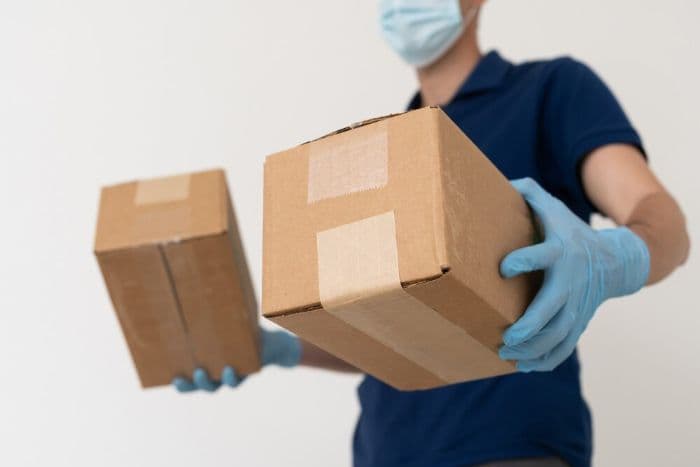 Medical courier carrying two packages