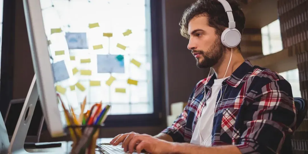 man working with his headphones on